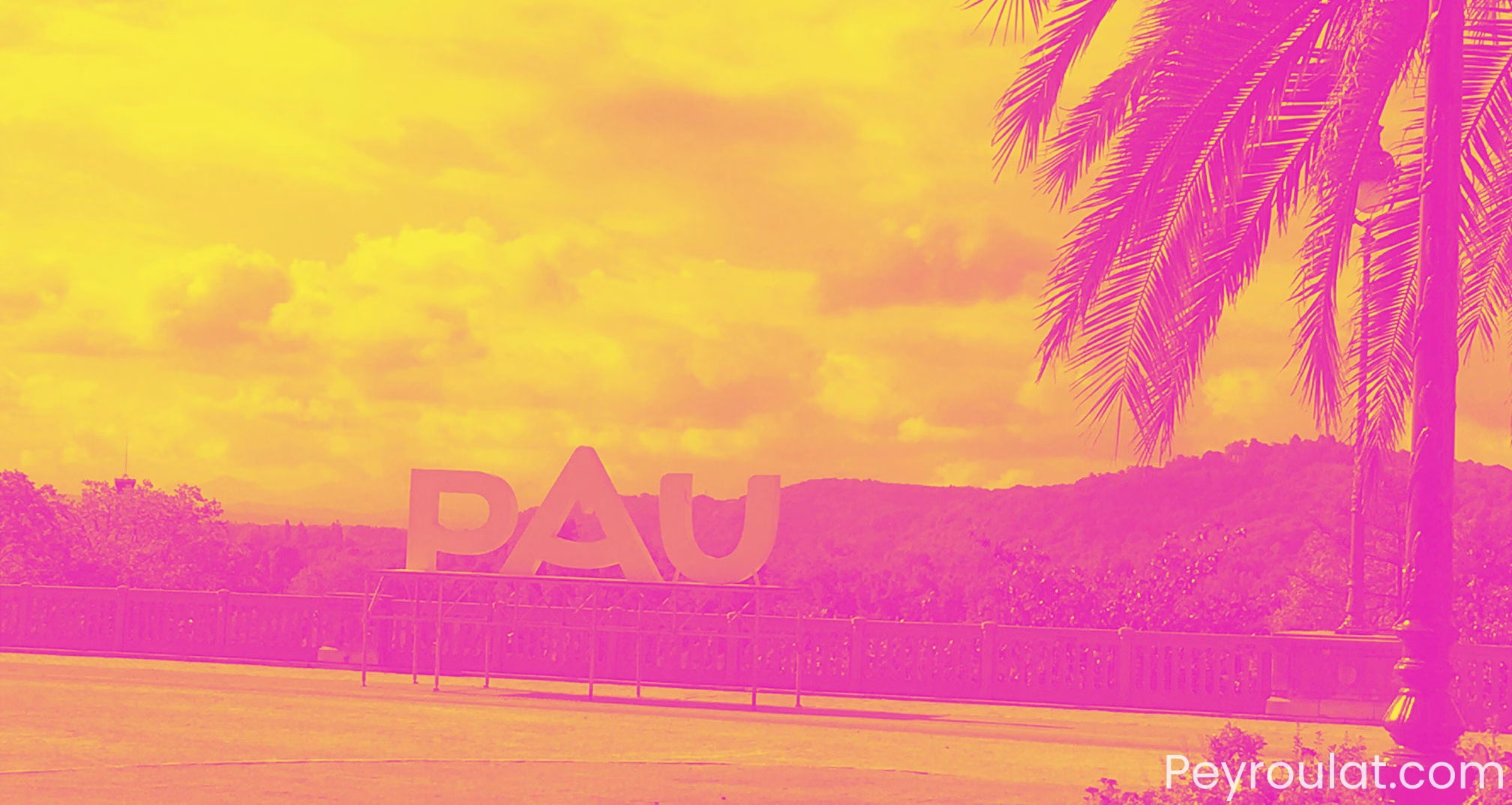 The image shows the Boulevard des Pyrenees in Pau France and a sign saying Pau on a stand. The image has a magenta overlay. Original image from Peyroulat.com