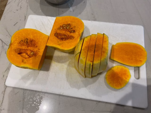 Fresh butternut squash cut into pieces.